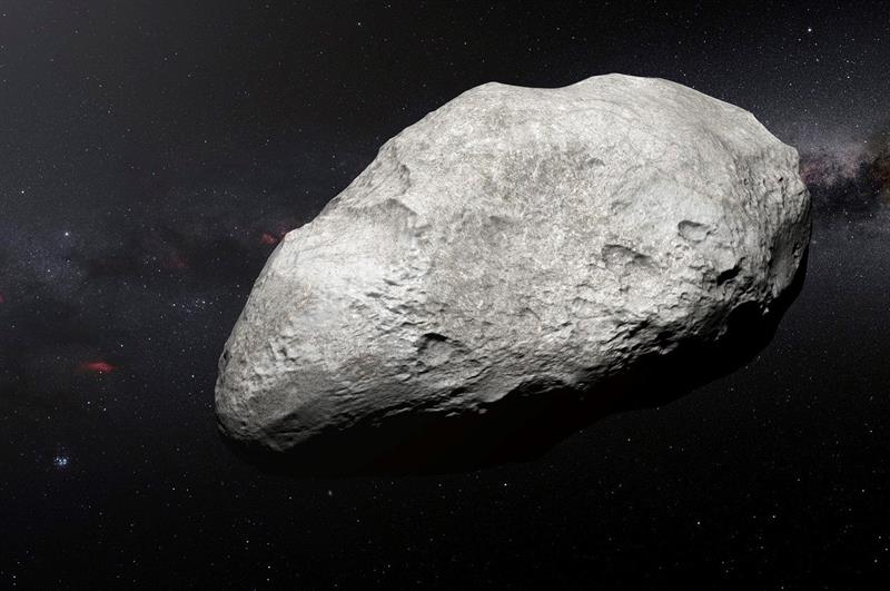 Esta ilustración muestra al asteroide exiliado 2004 EW95, el primer asteroide rico en carbono confirmado en el cinturón de Kuiper