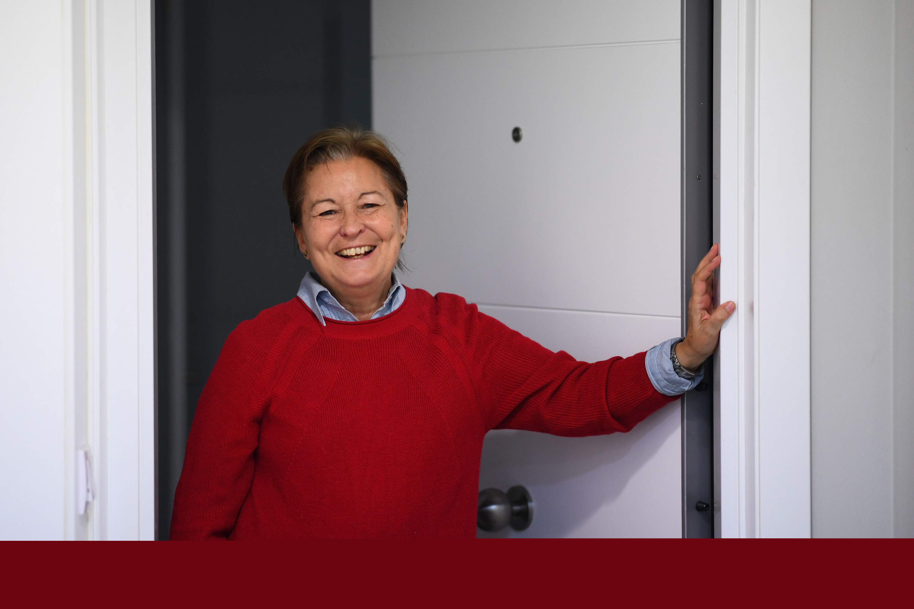 Dori Blas, 65, poses at her home's door in Madrid on March 30, 2020