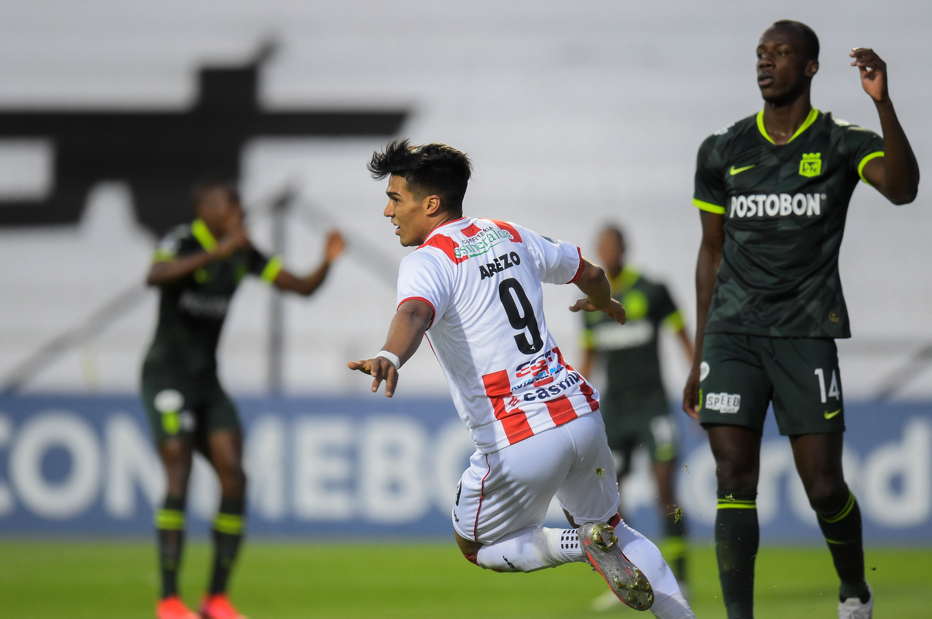 Matías Arezo celebra uno de sus goles frente al Atlético Nacional. Foto: AFP.
